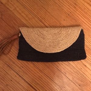 Beautiful woven black and nude clutch with tassel
